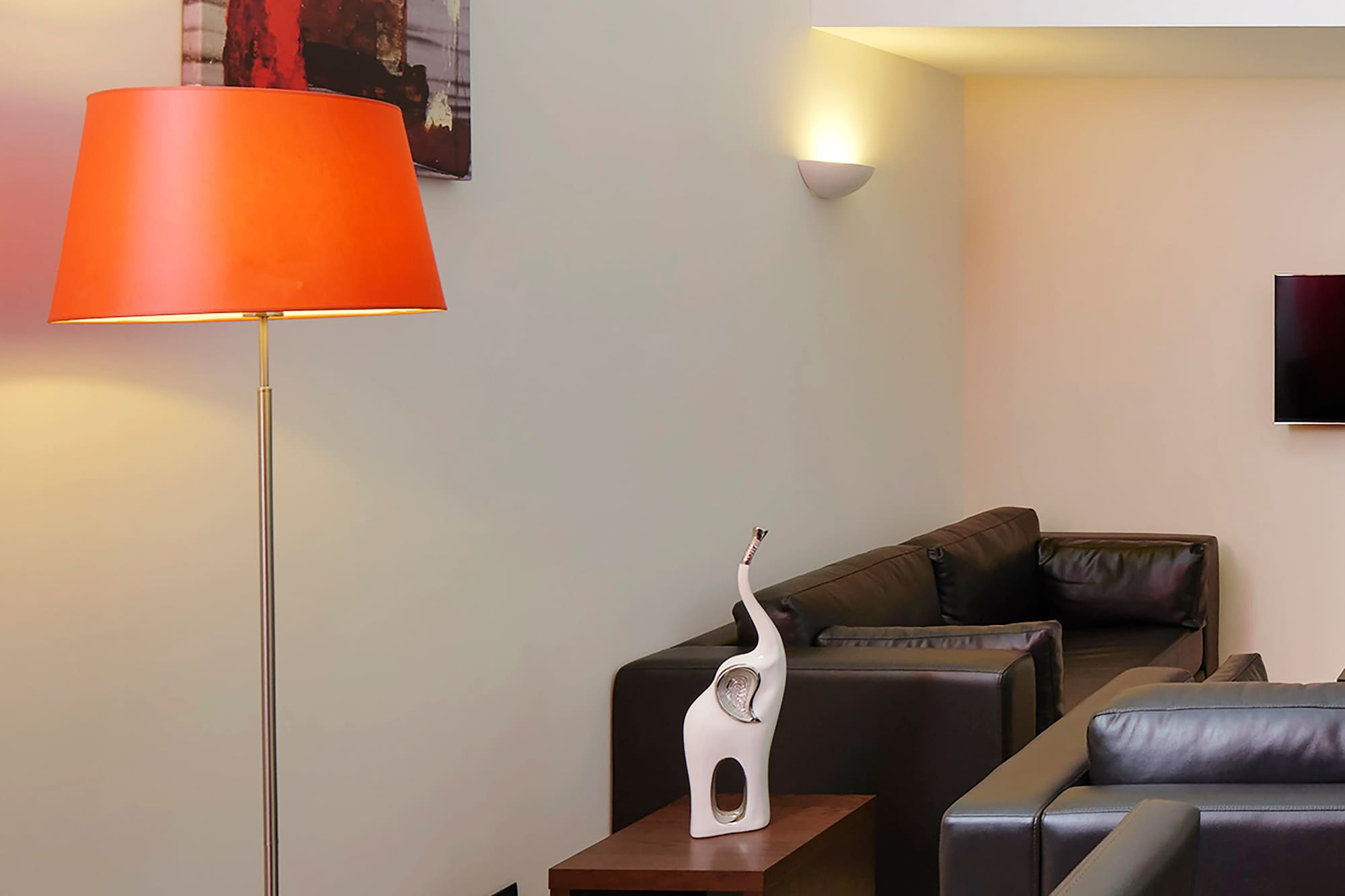 a room with a table and a lamp