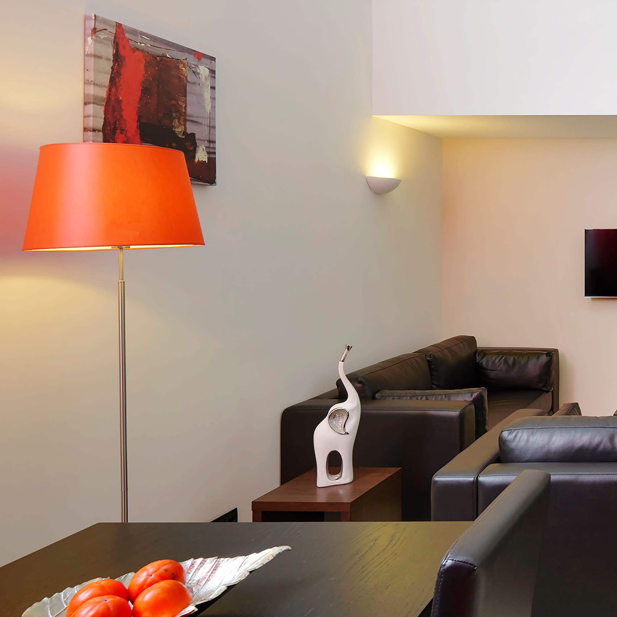 a room with a table and a lamp