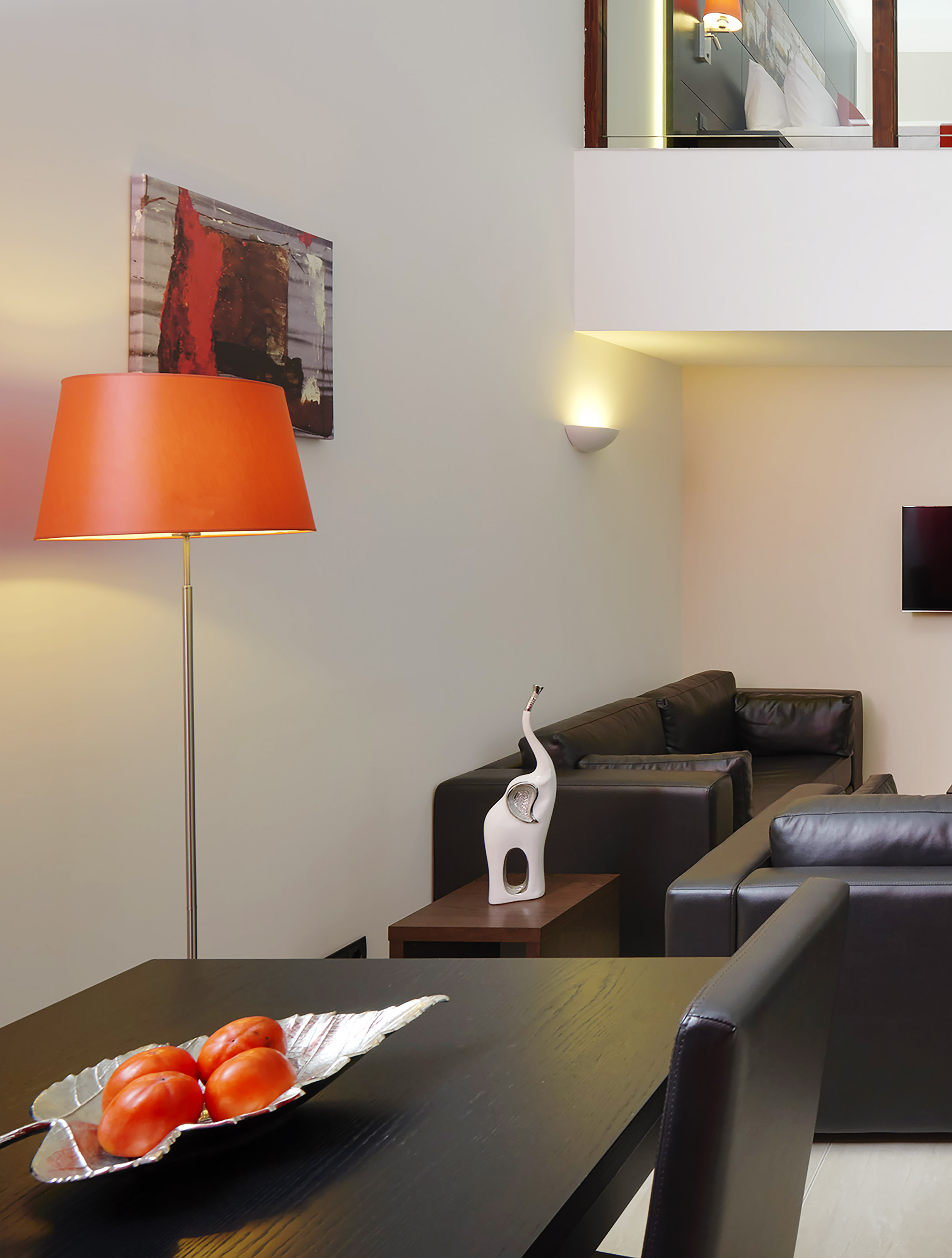 a room with a table and a lamp
