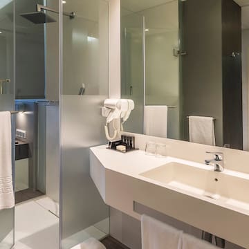 a bathroom with a shower and sink