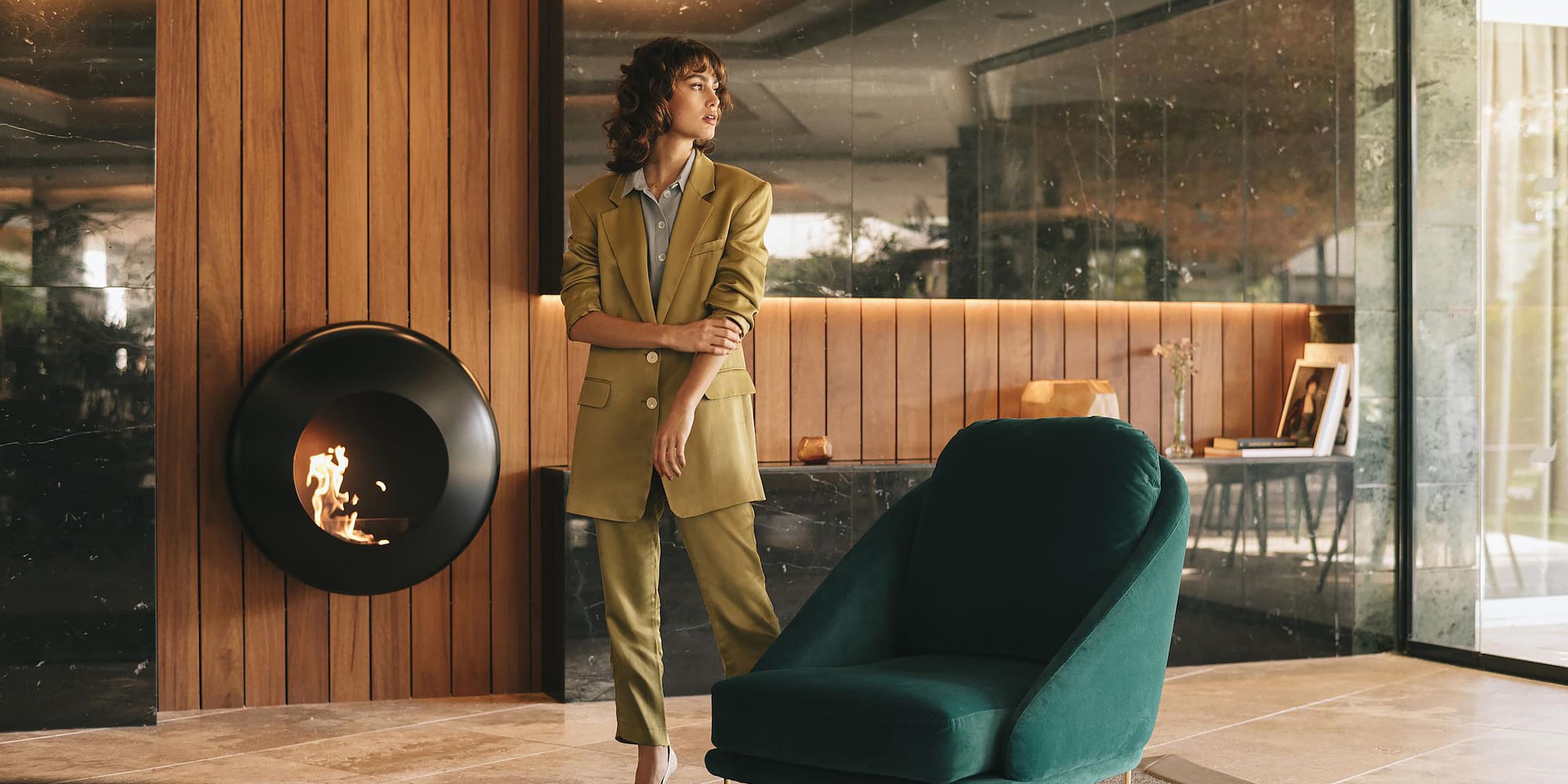 a woman standing next to a chair