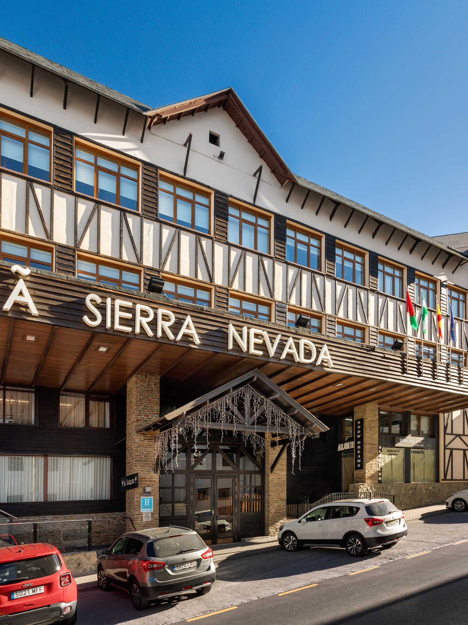 a building with cars parked in front of it