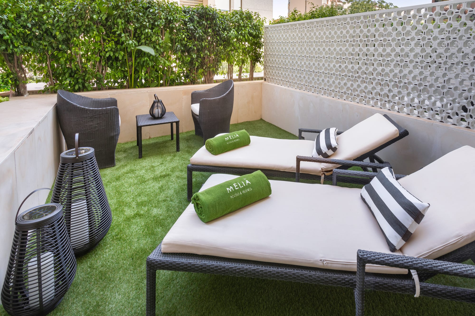 a patio with chairs and a table