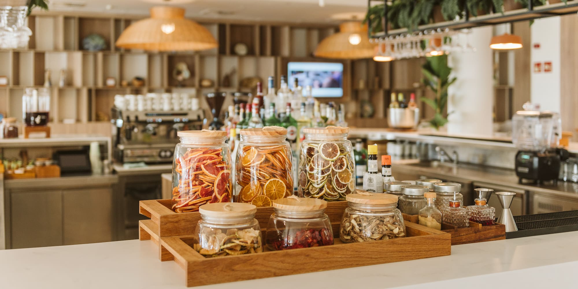 a counter with jars of dried fruits and other food items