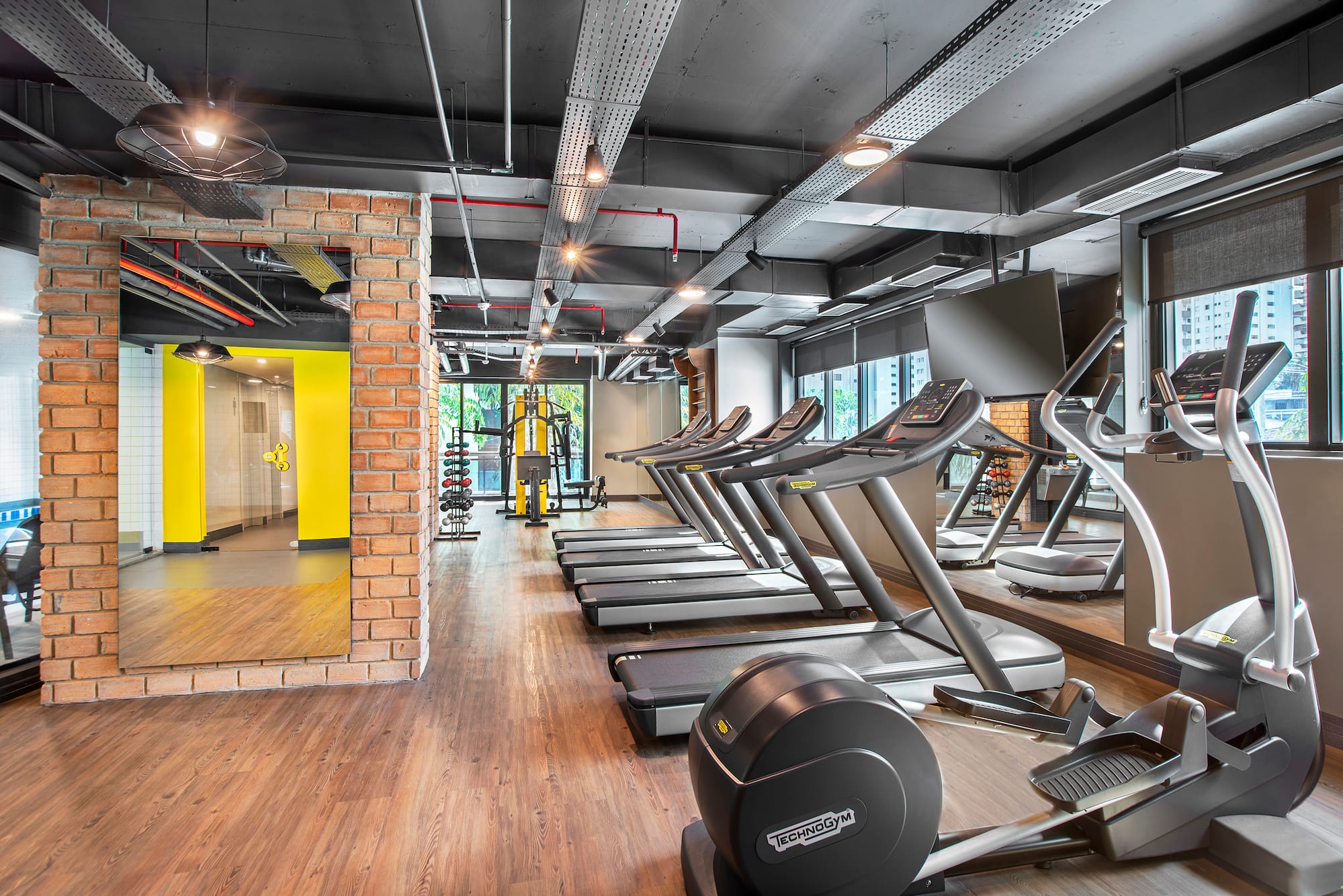 a room with treadmills and exercise equipment
