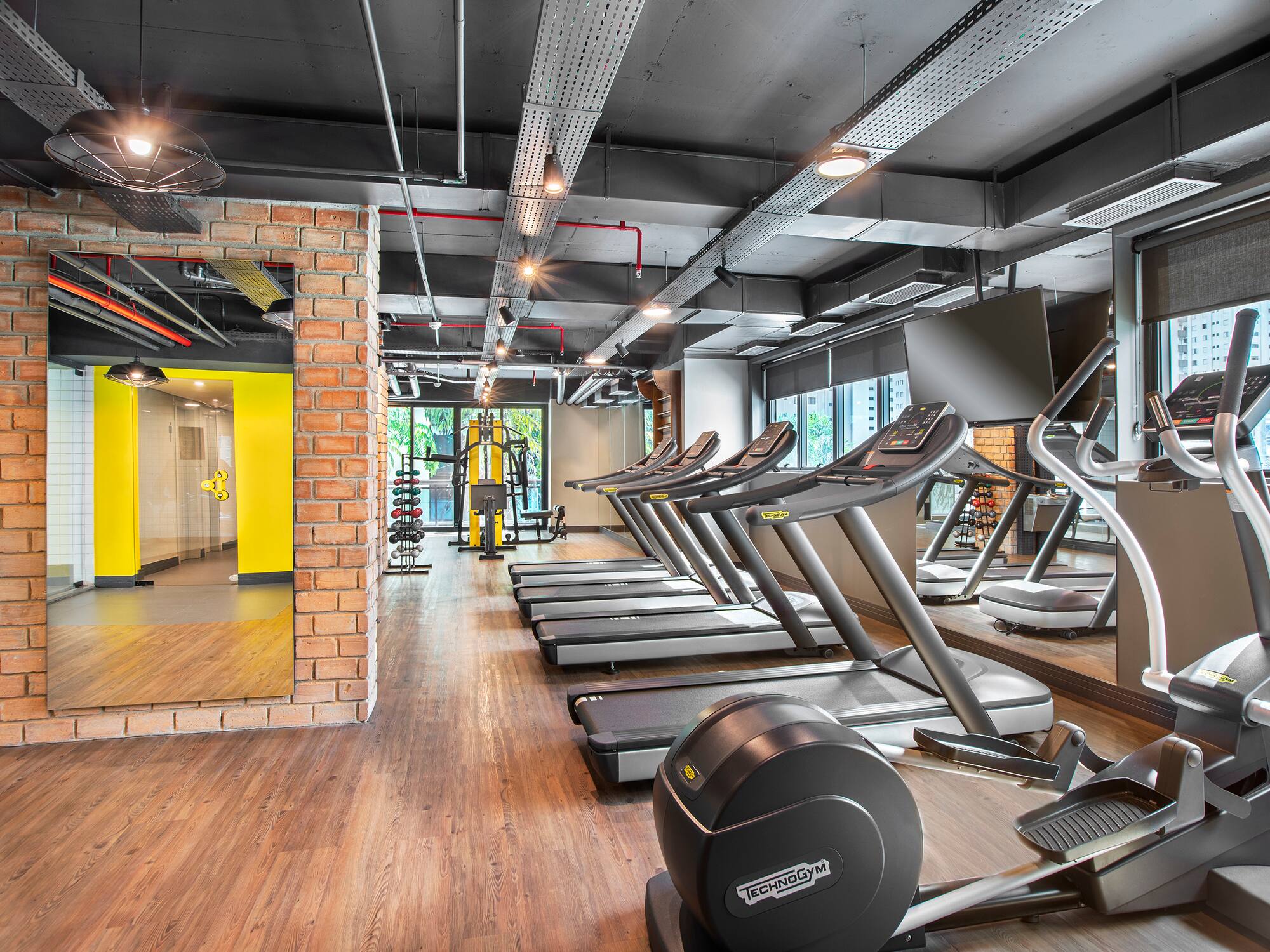 a room with treadmills and exercise equipment