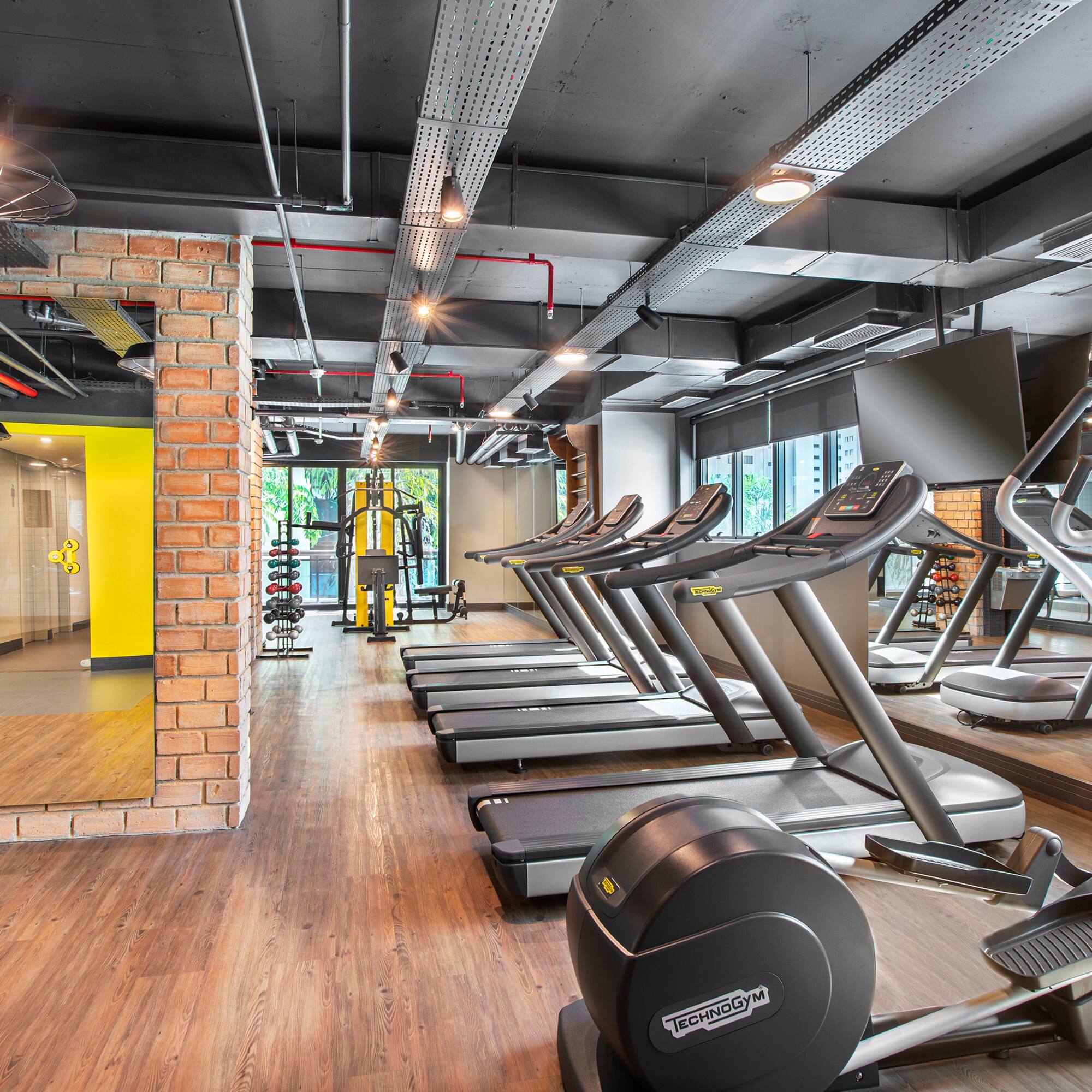 a room with treadmills and exercise equipment