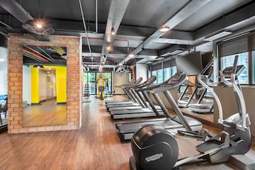 a room with treadmills and exercise equipment