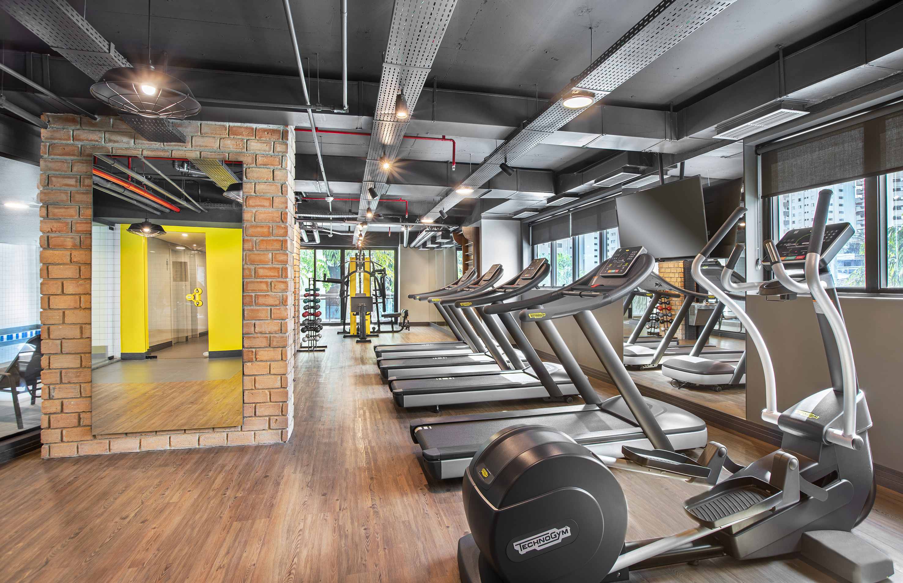 a room with treadmills and exercise equipment