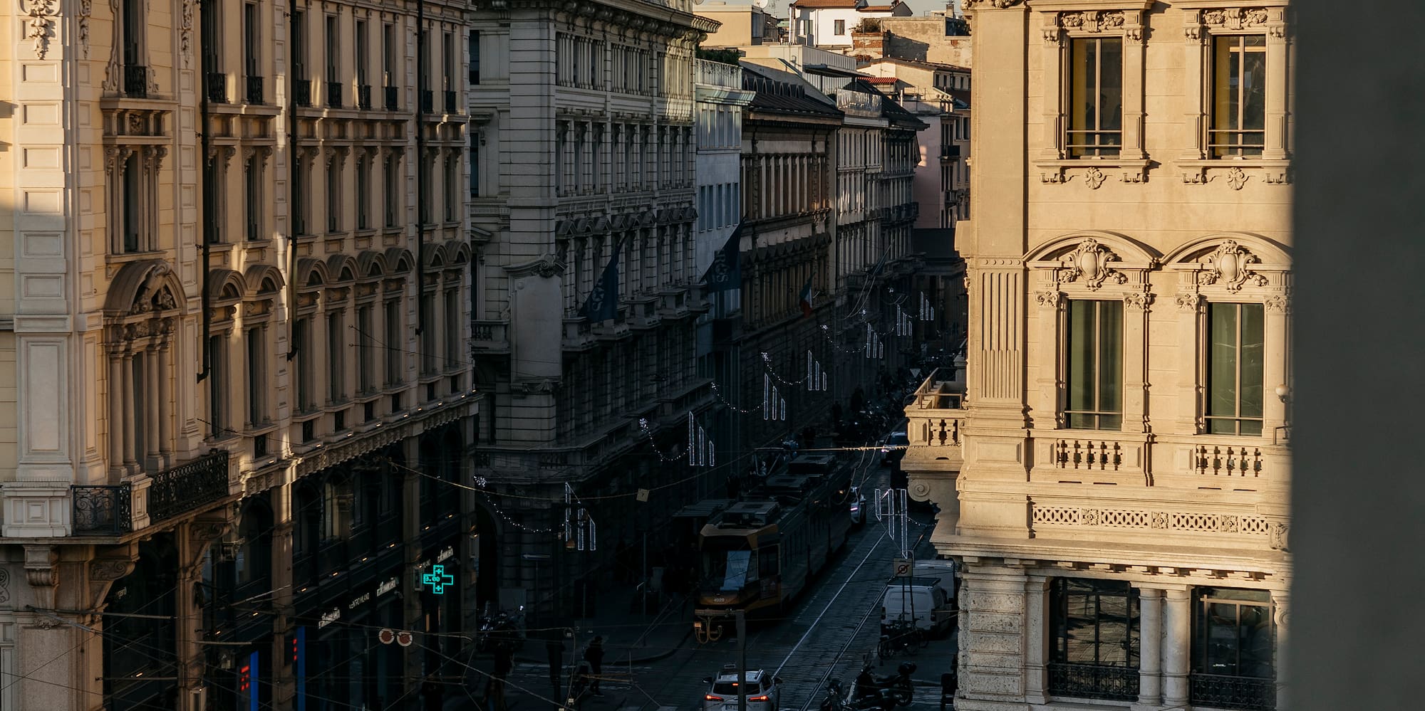 a street with buildings and a tram