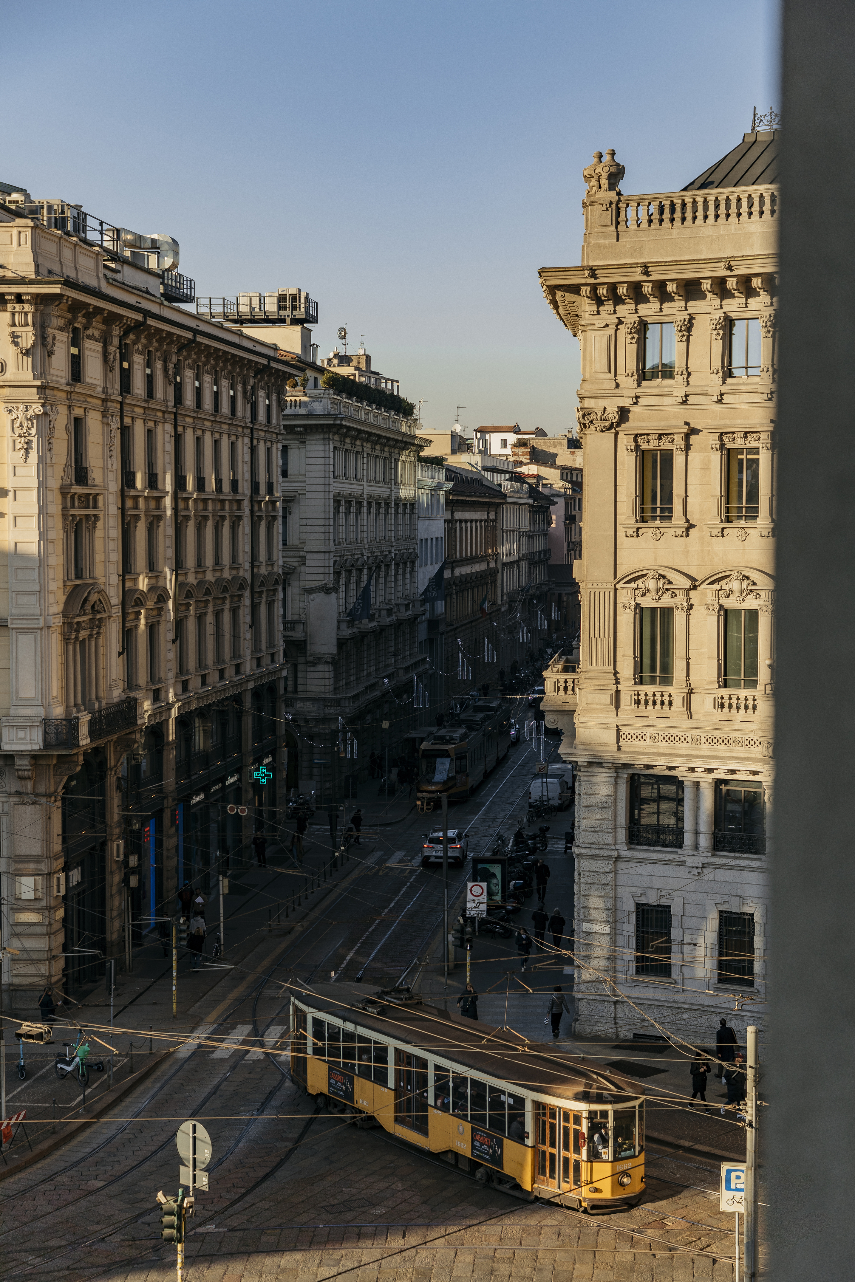 a street with buildings and a tram