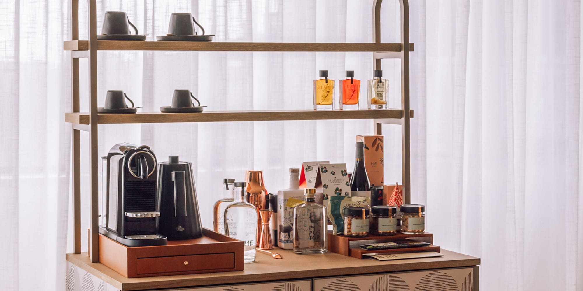 a counter with a shelf and coffee maker