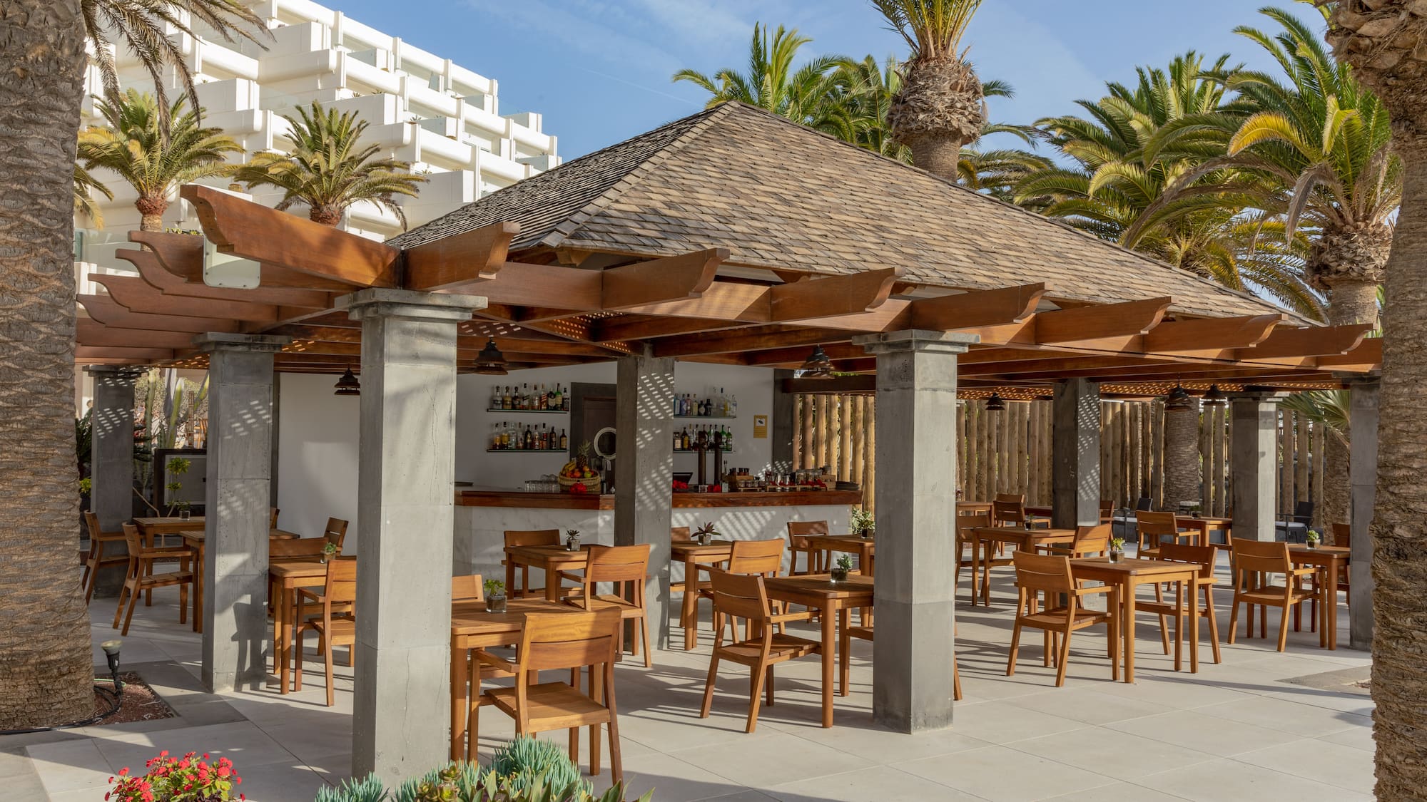 a patio with tables and chairs