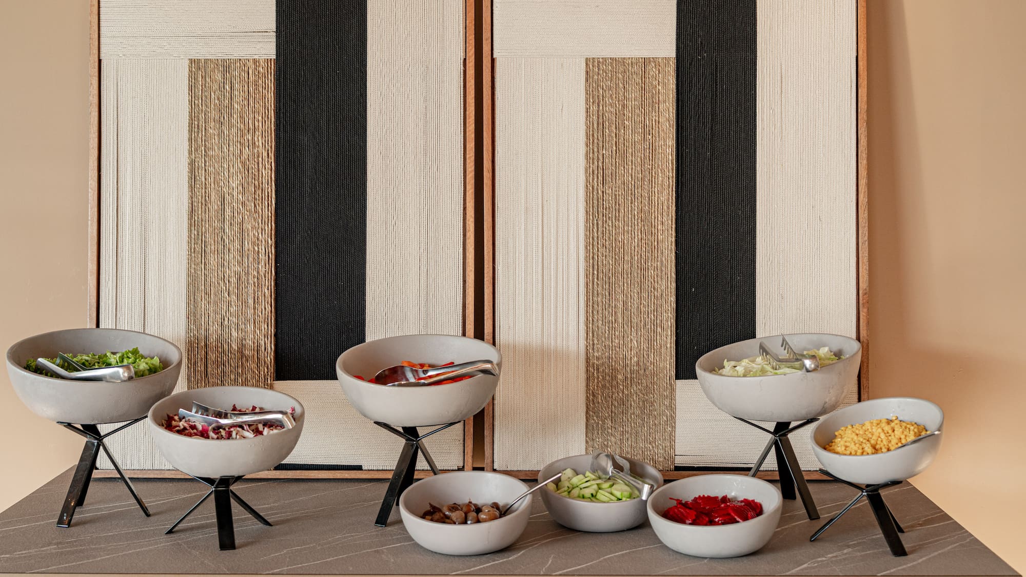 a buffet table with bowls of food