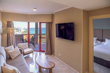 a living room with a television on the wall