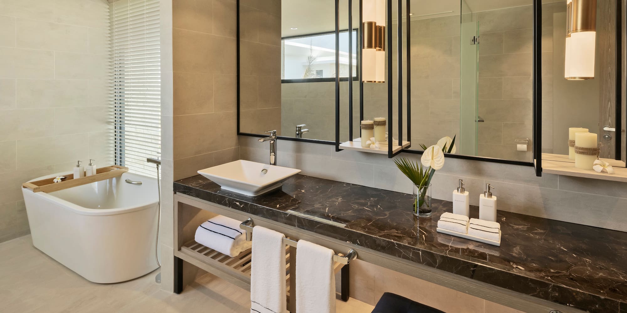 a bathroom with a mirror and sink