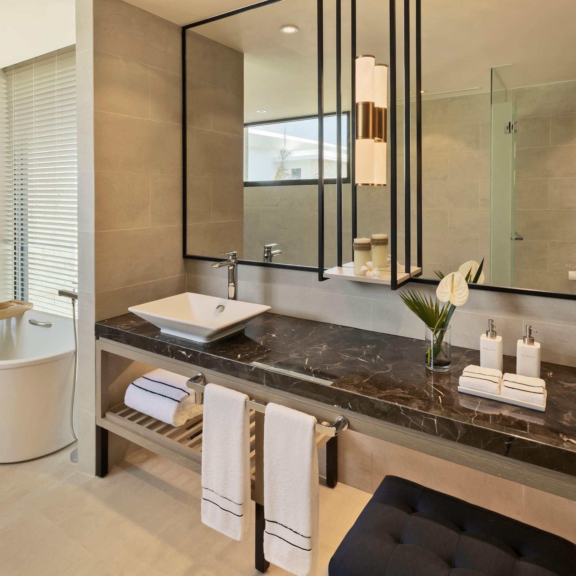 a bathroom with a mirror and sink