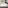 a bed with white sheets and pillows