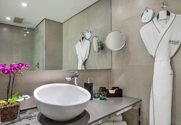 a bathroom with a sink and towels