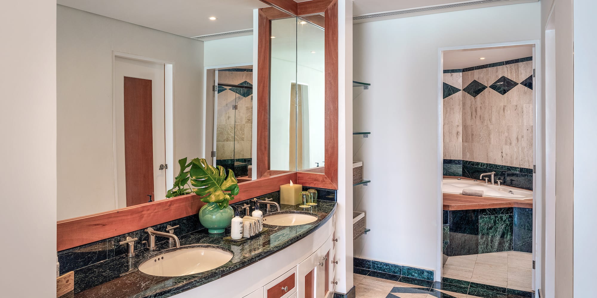 a bathroom with a large mirror and a sink