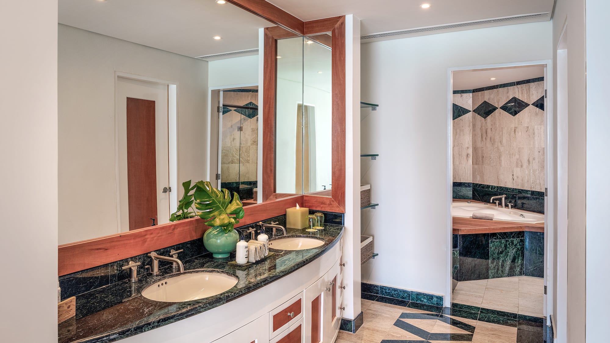 a bathroom with a large mirror and a sink