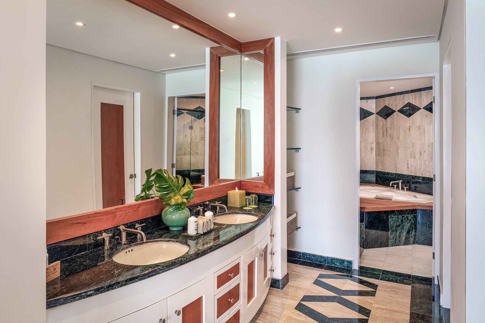 a bathroom with a large mirror and a sink