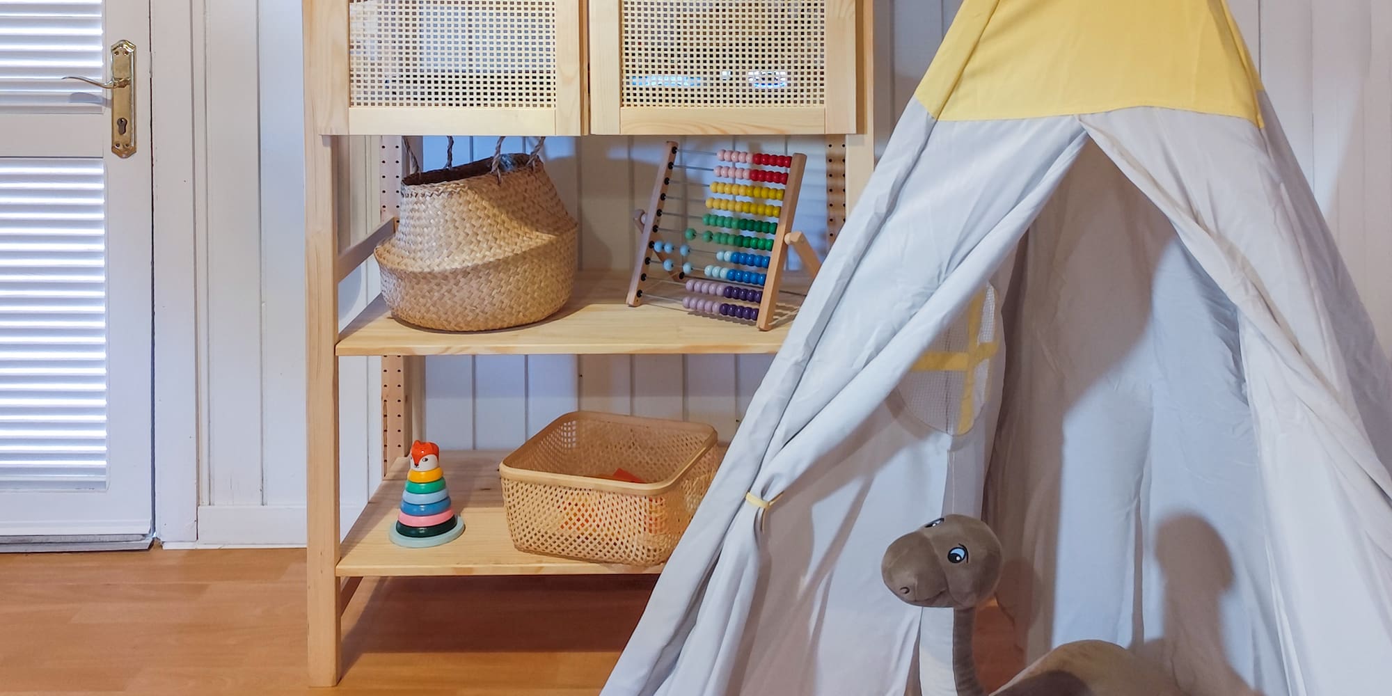 a toy tent and stuffed animals in a room