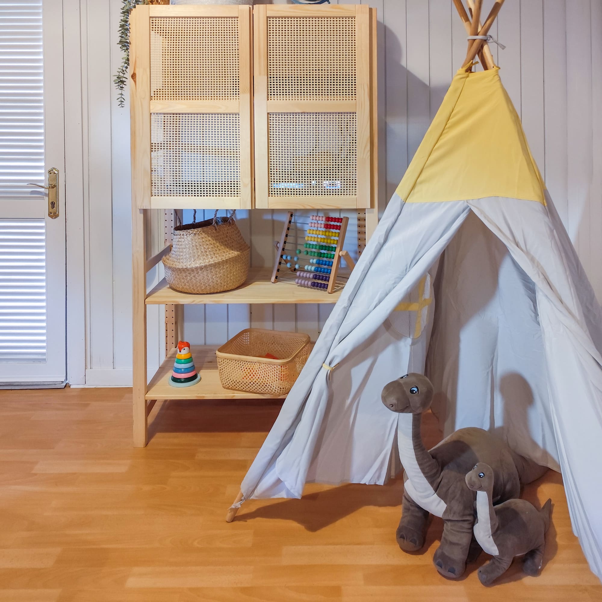 a toy tent and stuffed animals in a room
