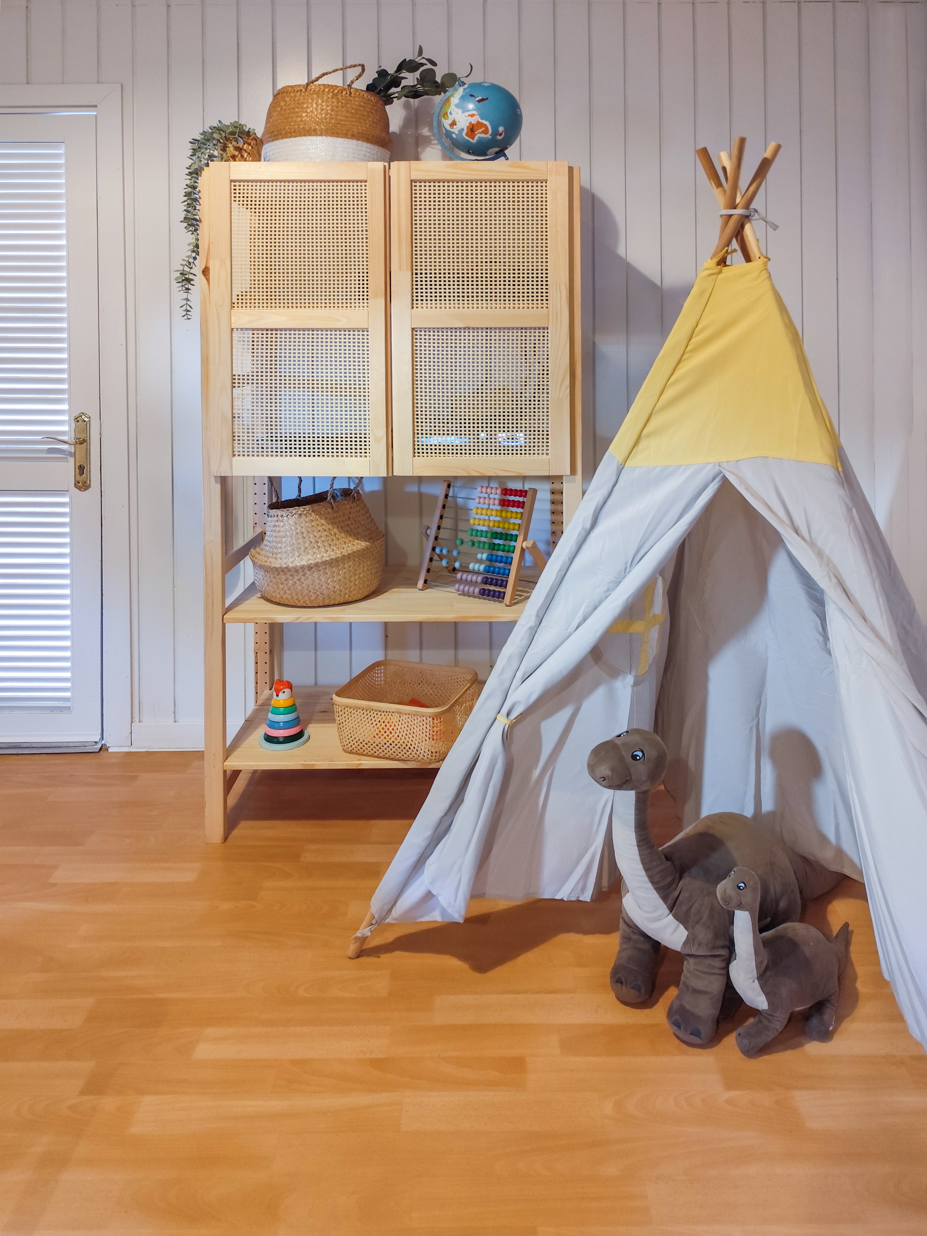 a toy tent and stuffed animals in a room