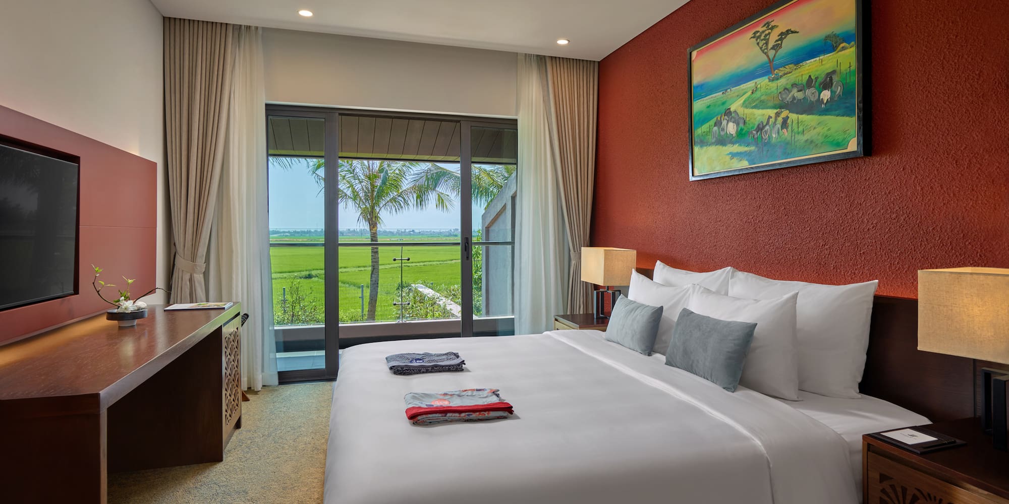 a bedroom with a large bed and a window