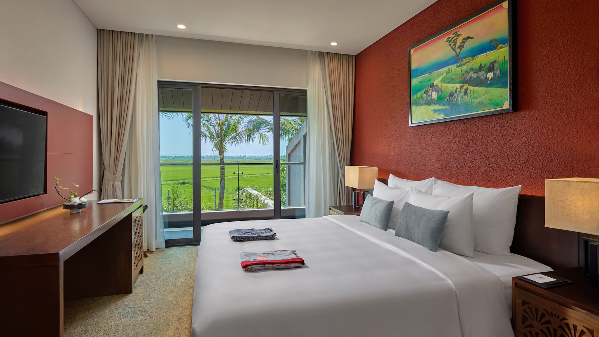 a bedroom with a large bed and a window