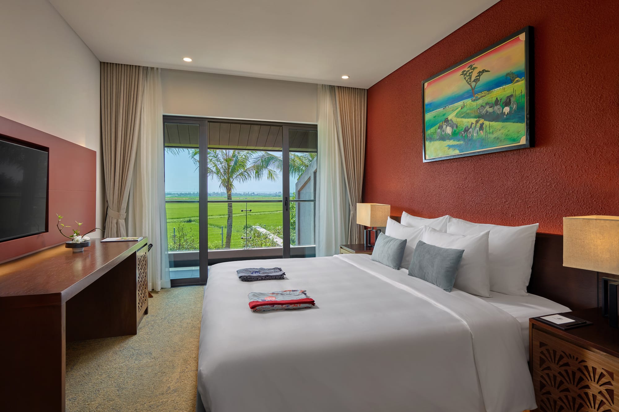 a bedroom with a large bed and a window