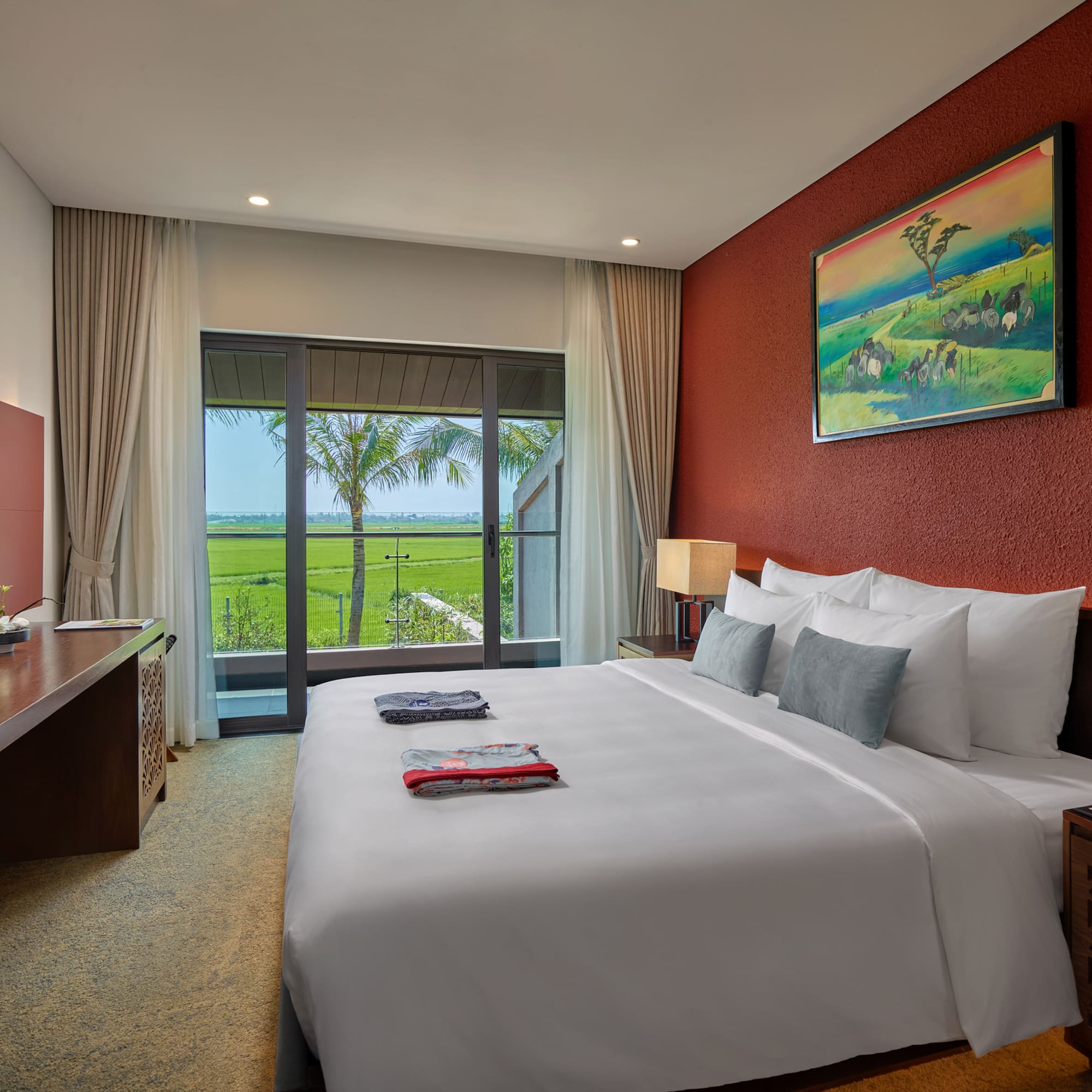 a bedroom with a large bed and a window