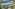 Aerial view: Tropical resort with large aquazone water park and multiple swimming pools.