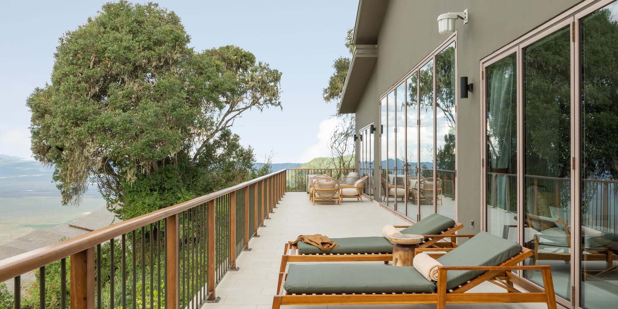 a deck with chairs and a railing