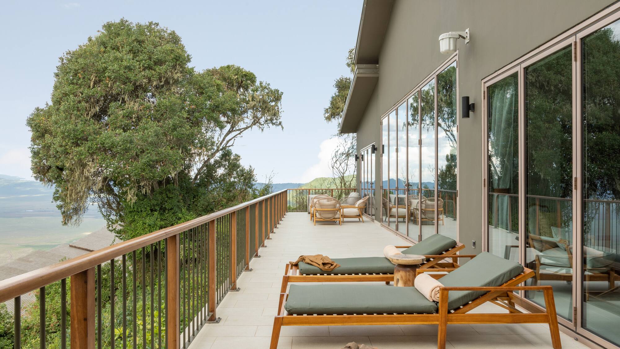 a deck with chairs and a railing