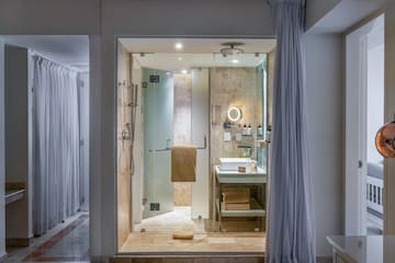 a bathroom with a shower and sink
