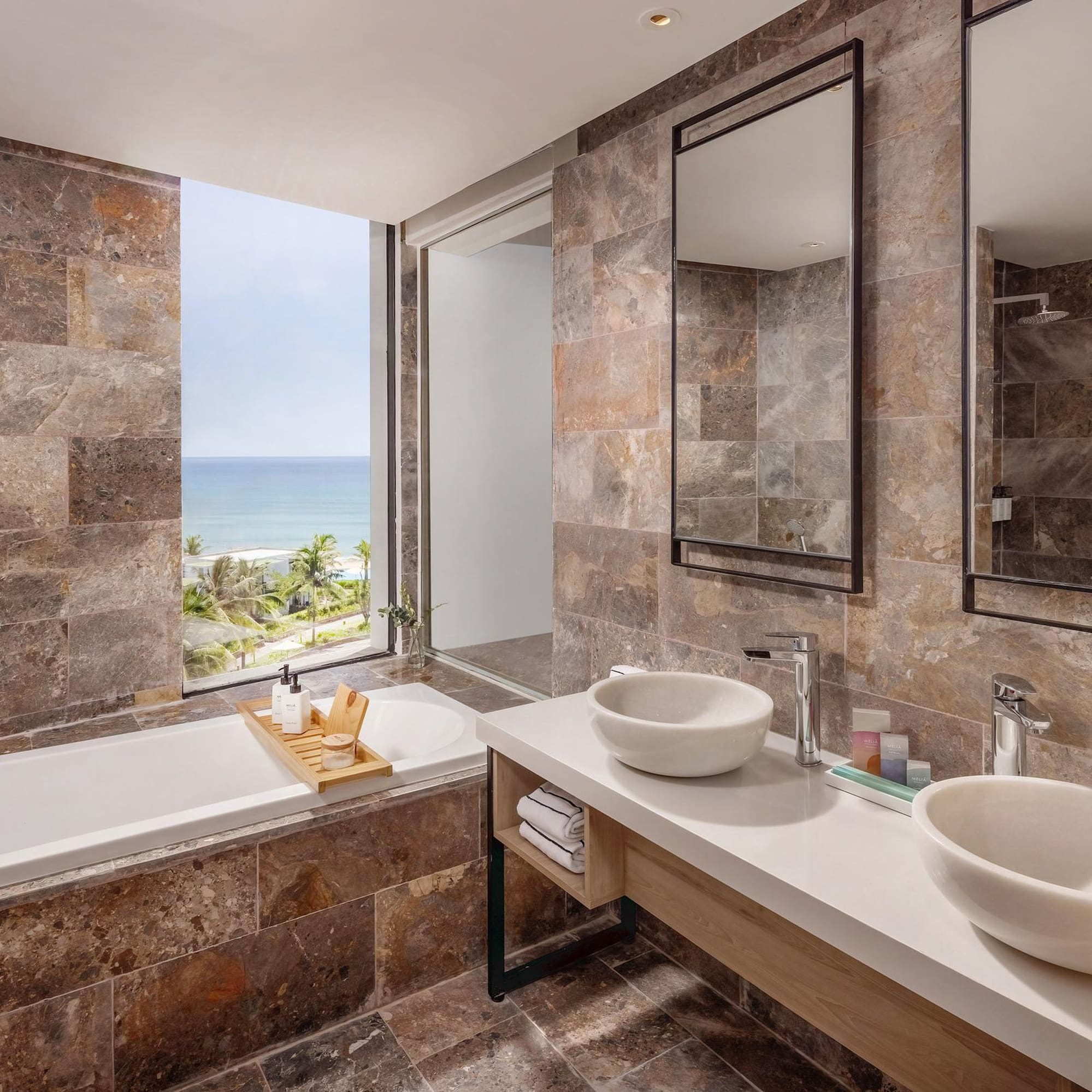 a bathroom with a bathtub and sinks