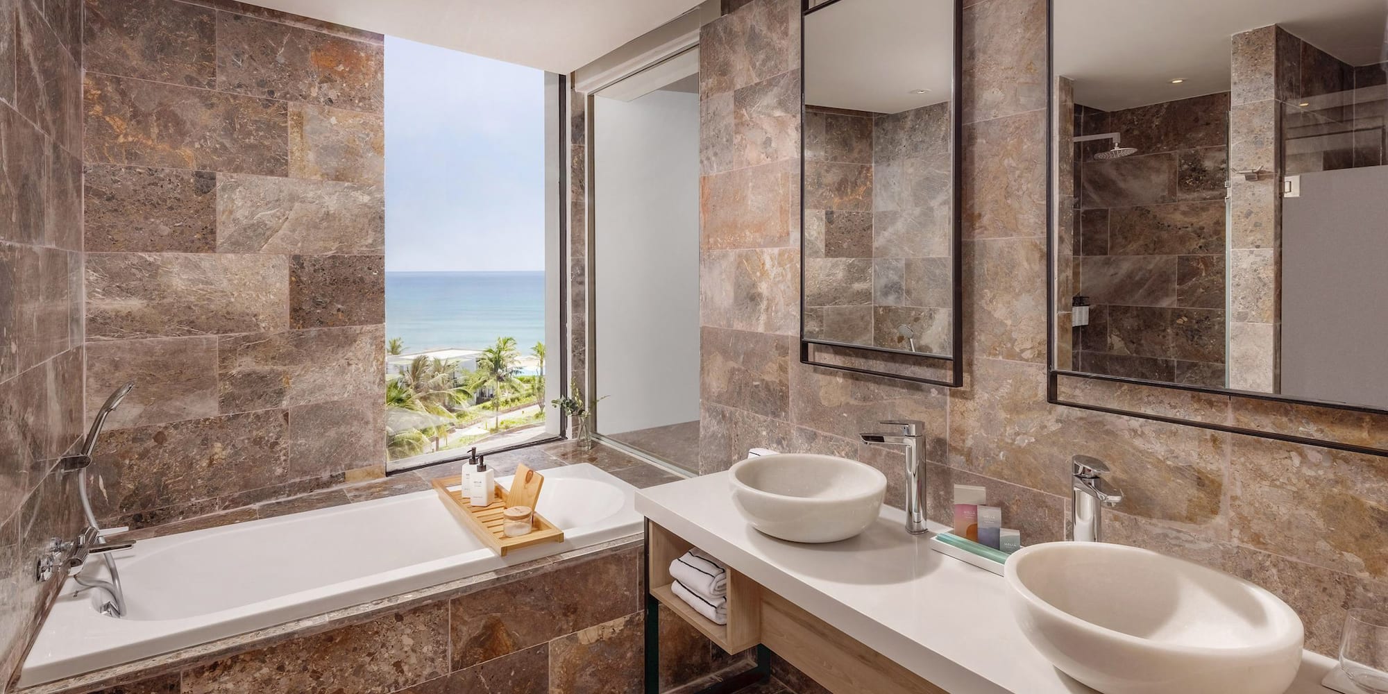 a bathroom with a bathtub and sinks