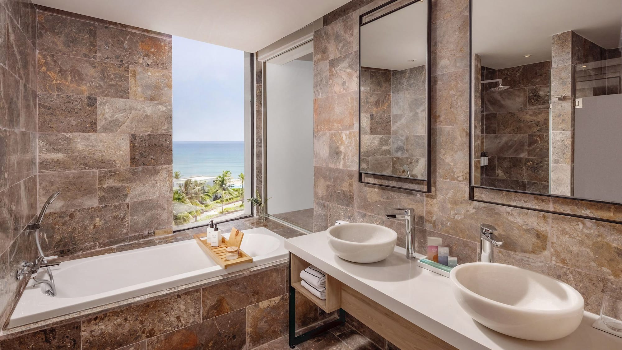 a bathroom with a bathtub and sinks