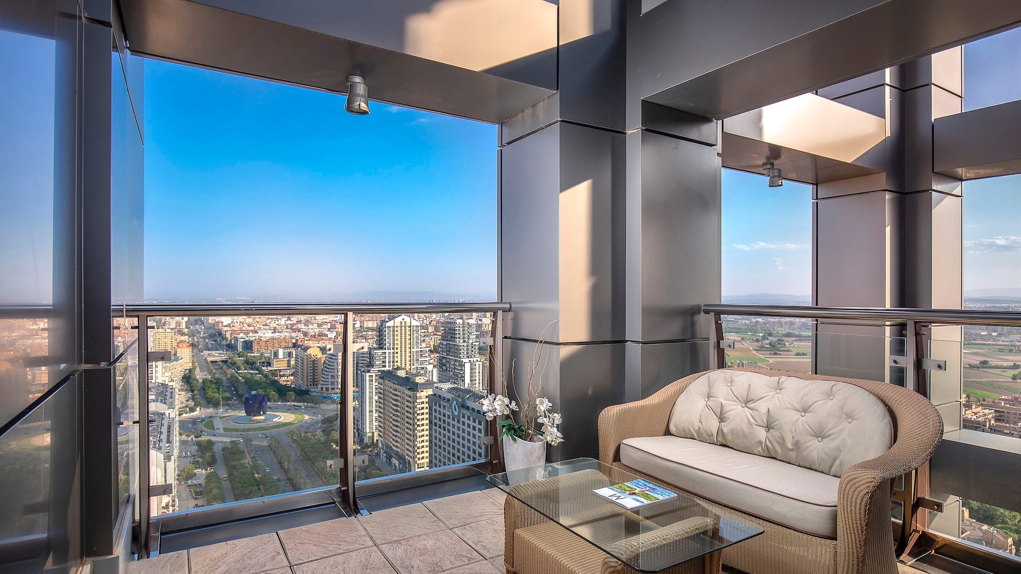 a balcony with a couch and a table