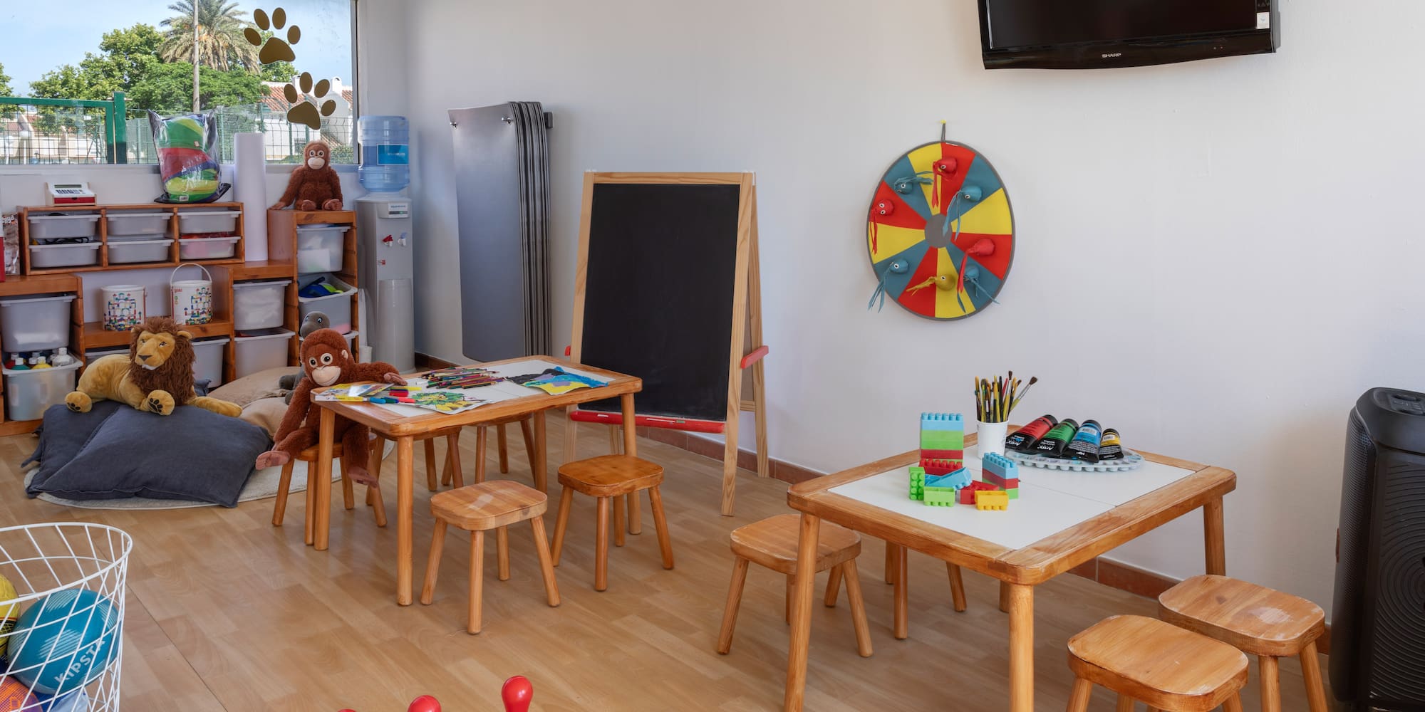 a room with a blackboard and table and chairs