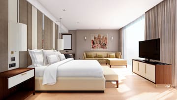 a room with a bed and couches