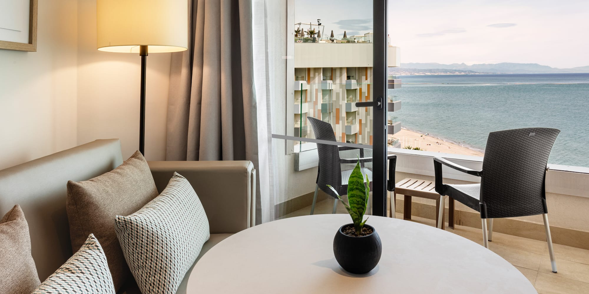 a room with a window overlooking the ocean