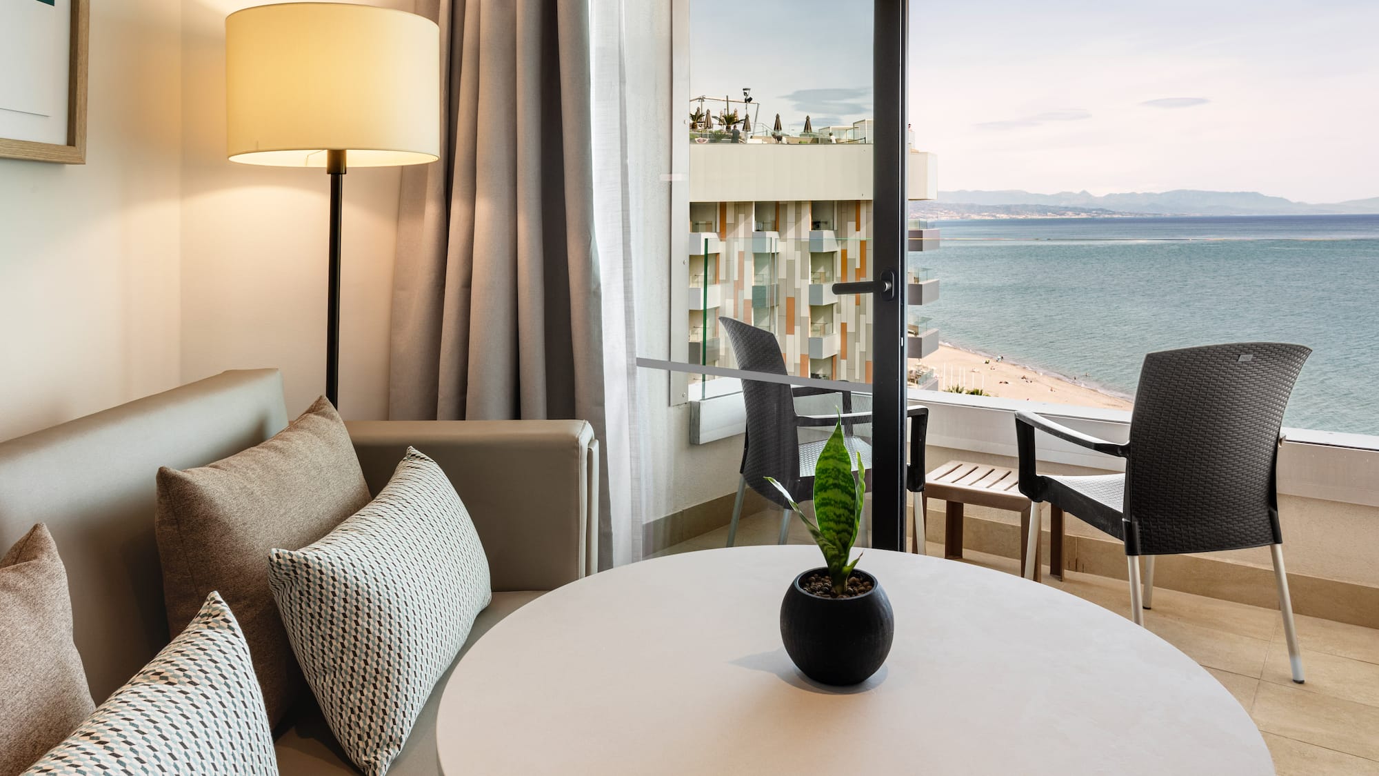 a room with a window overlooking the ocean