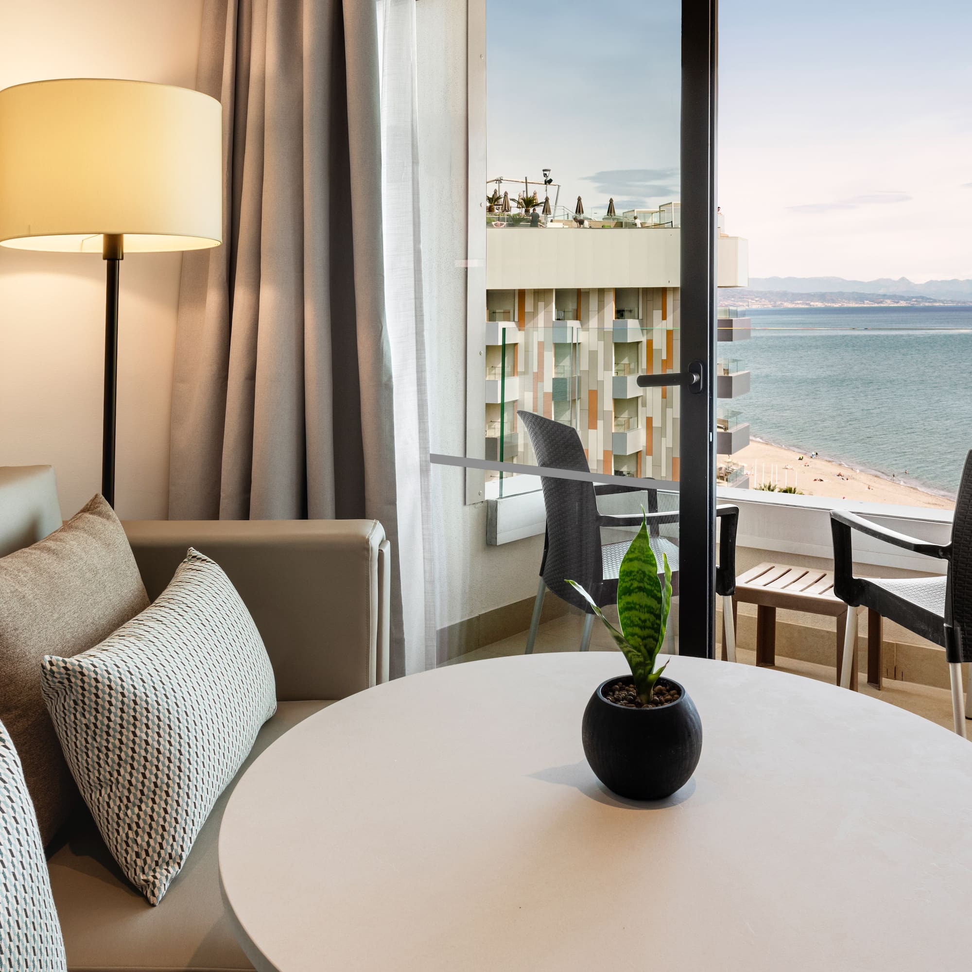 a room with a window overlooking the ocean