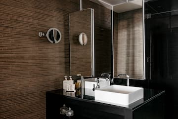 a bathroom with a mirror and sink