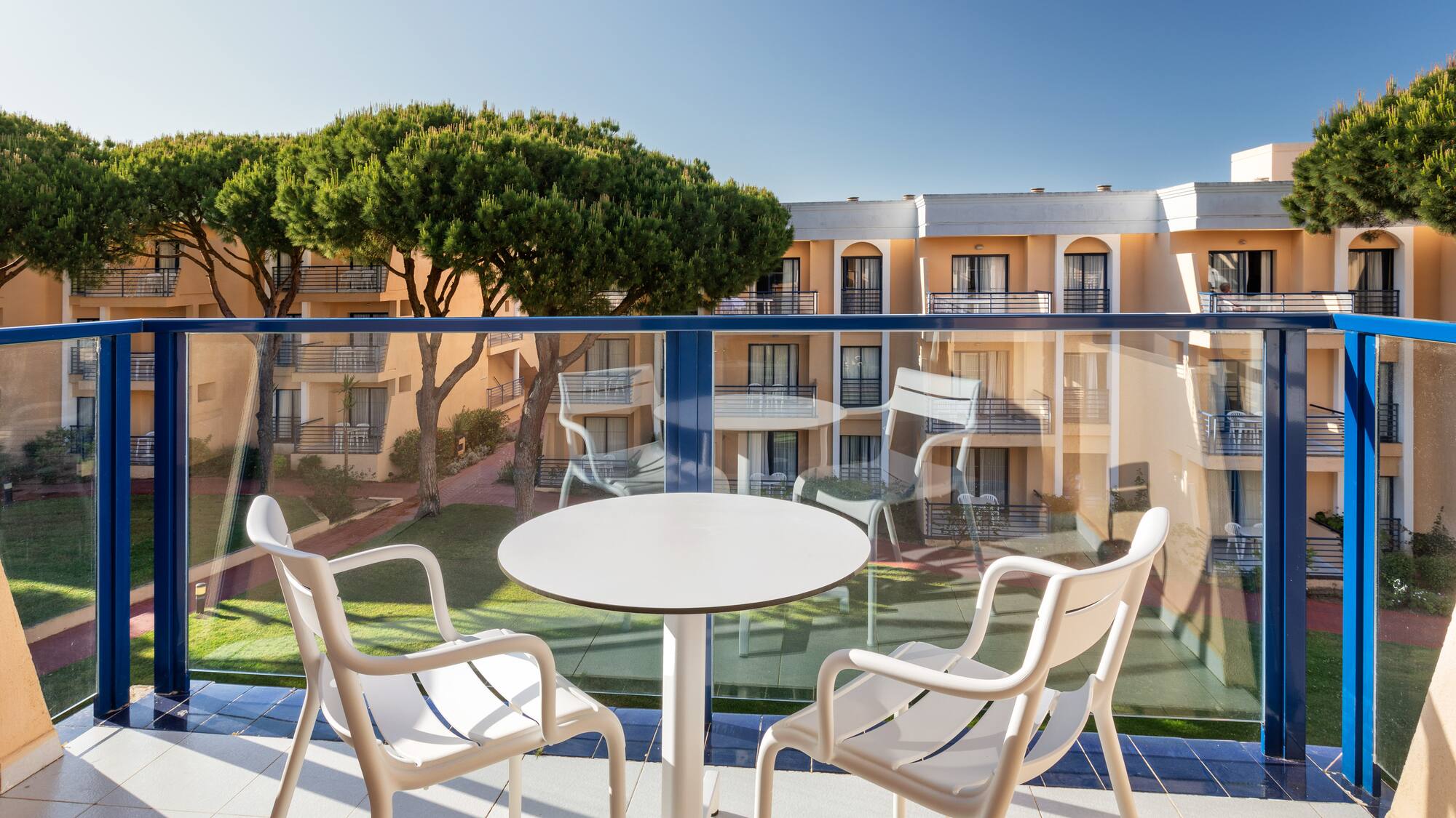 a table and chairs on a balcony