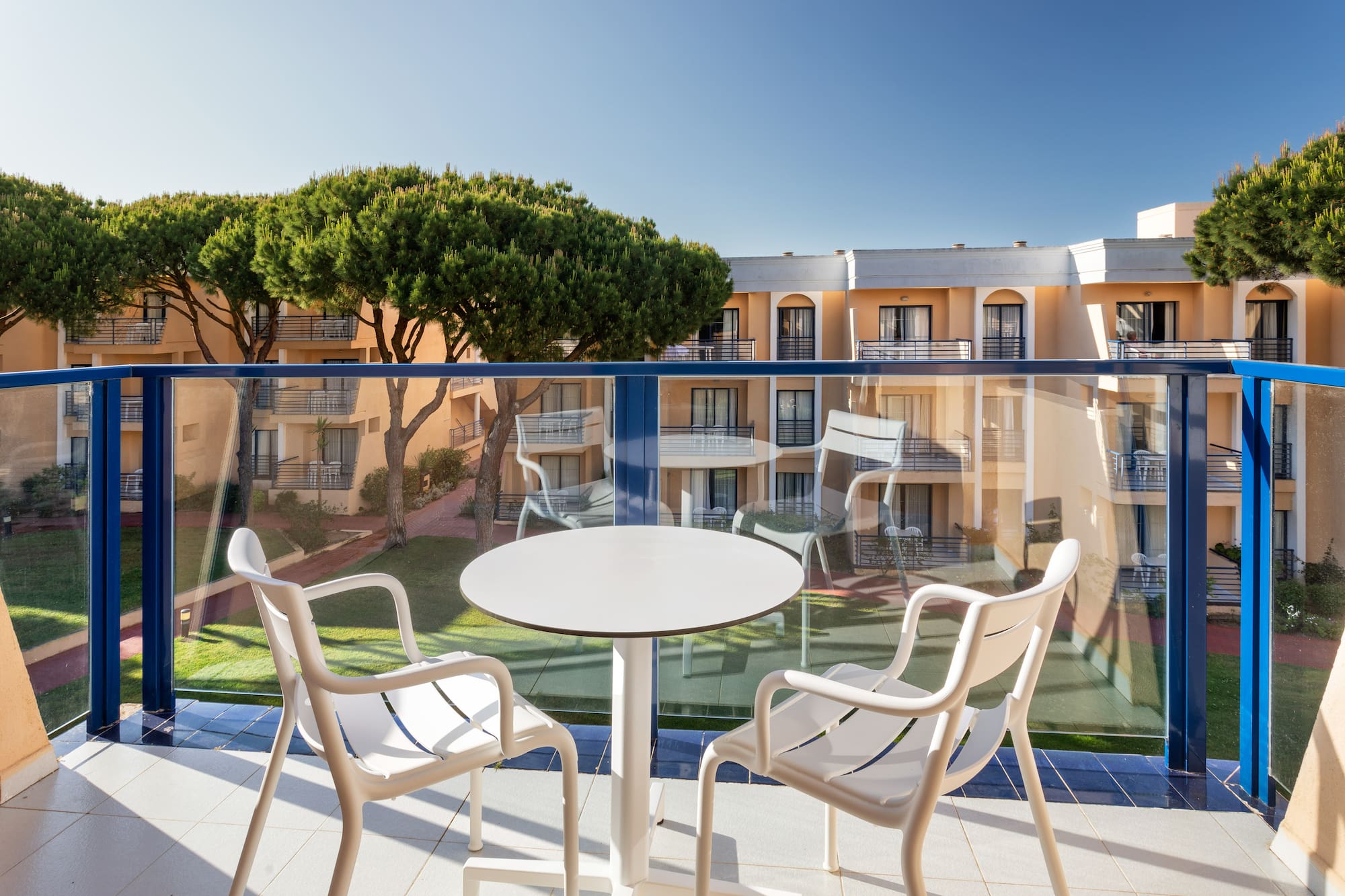 a table and chairs on a balcony