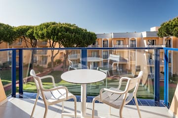 a table and chairs on a balcony